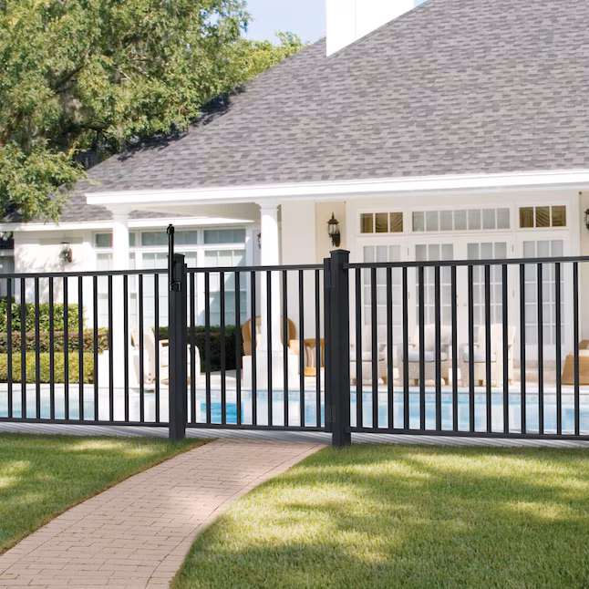 Black aluminum fencing enclosing a residential swimming pool
